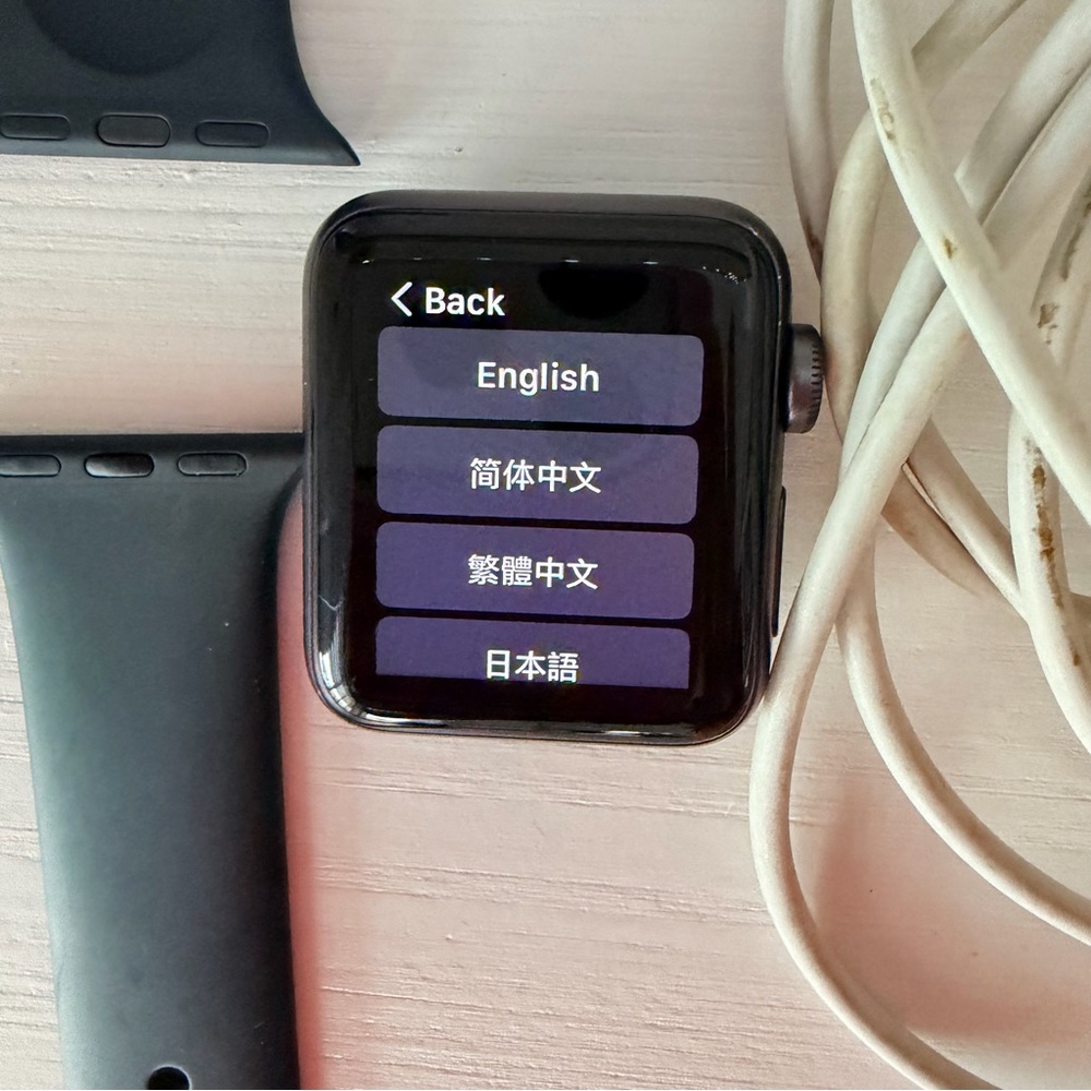 Apple Watch black with Black Sport Band and charging cable